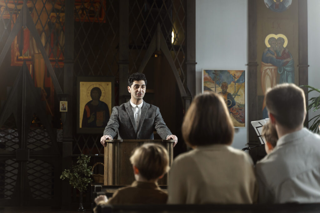 medium-shot-young-pastor-preaching-church (1)