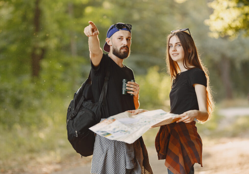 Adventure, travel, tourism, hike and people concept. Couple in a forest.